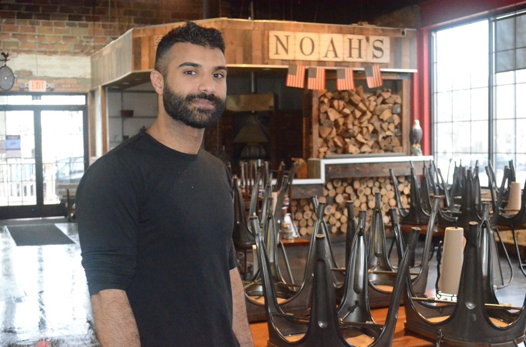 Noah Saleh stands in front of an empty smokehouse at Noah's Smokehouse in Dearborn, Mich.